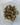 Raw brown green apatite crystal with natural hexagonal prism shape and olive-amber color variation on a lighter matrix base