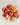 Carnelian palm stone in honey orange to deep red chalcedony with translucent color zoning