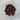 Mahogany obsidian tumbled stone with black and deep red brown streaking from iron inclusions