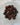 Mahogany obsidian tumbled stone with black and deep red brown streaking from iron inclusions