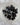 Snowflake obsidian tumbled stone with black body and white cristobalite flower inclusions