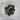South African jade tumbled stone with dense green color and subtle white matrix veining